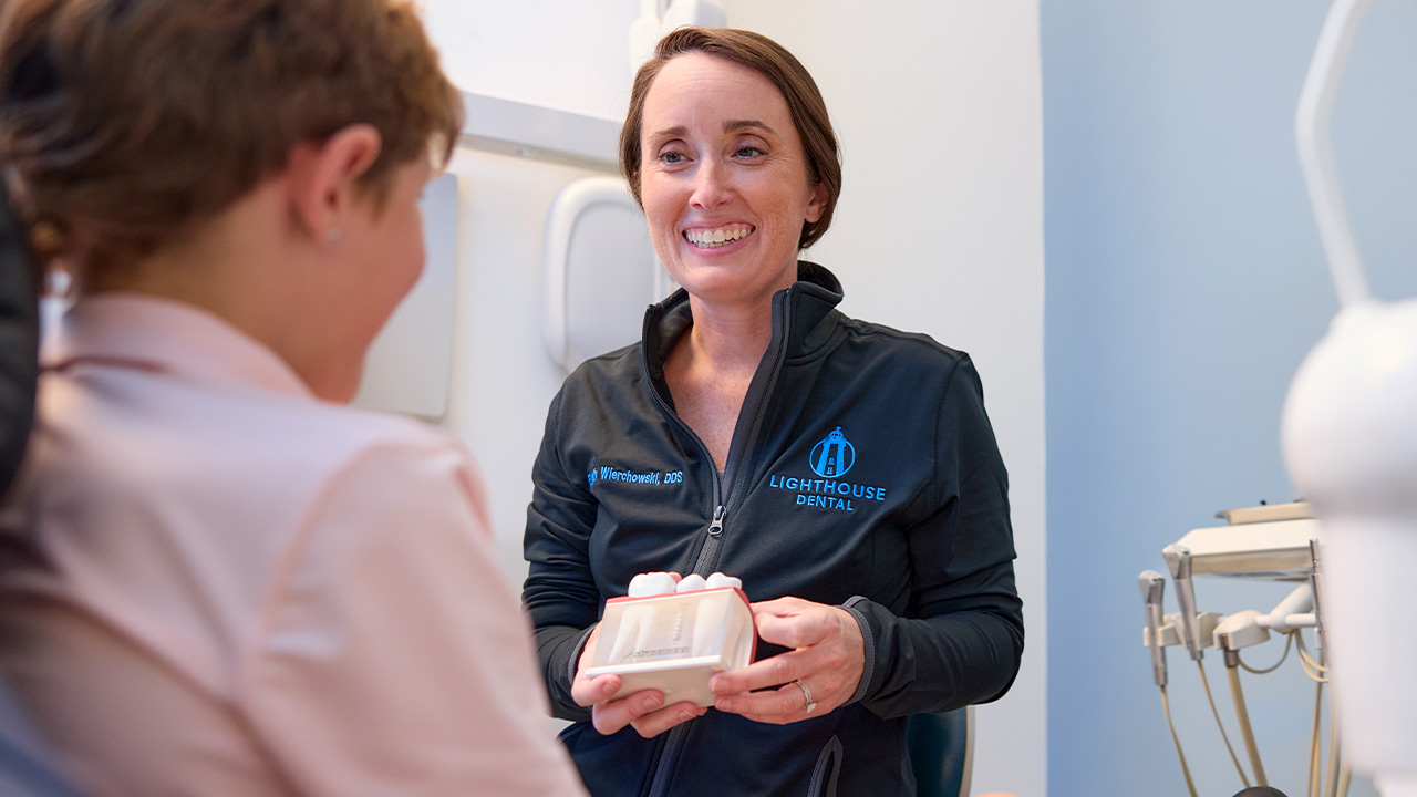 Dr. Elizabeth Wierchowski, DDS with a patient